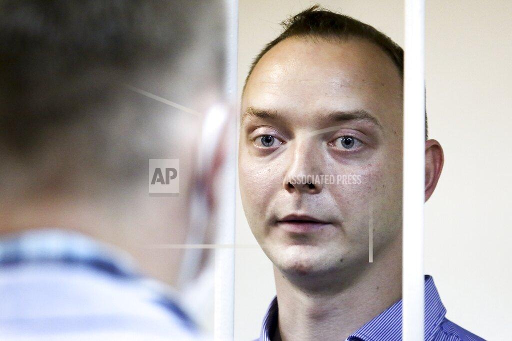Sofia Sandurskaya Ivan Safronov, an adviser to the director of Russia's state space corporation, stands behind bars in a courtroom in Moscow, Russia, Tuesday, July 7, 2020. Safronov, a former journalist who worked as an adviser to the director of the Russian state space corporation, pleaded innocent to the treason charges against him. Ivan Safronov, a former journalist who served as an adviser to Roscosmos head Dmitry Rogozin, was detained in Moscow by agents of the Federal Security Service (FSB), the main KGB successor agency. (Sofia Sandurskaya, Moscow News Agency photo via AP)