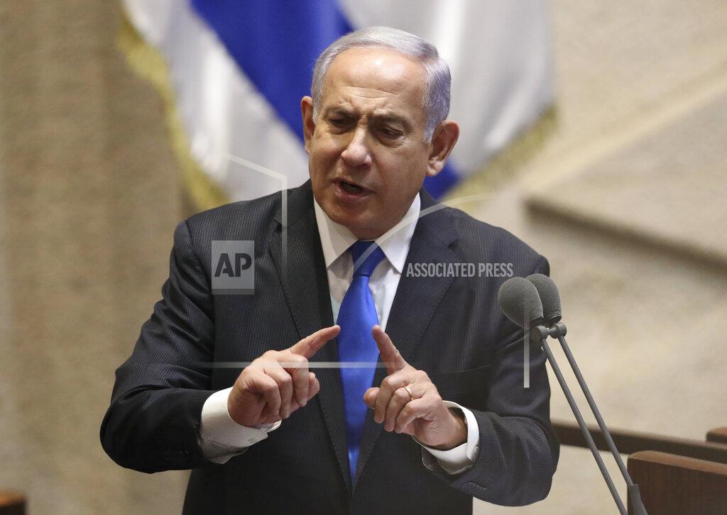 Ariel Schalit Israel's outgoing prime minister Benjamin Netanyahu speaks during a Knesset session in Jerusalem Sunday, June 13, 2021. Bennett is expected later Sunday to be sworn in as the country's new prime minister, ending Prime Minister Benjamin Netanyahu's 12-year rule. (AP Photo/Ariel Schali22