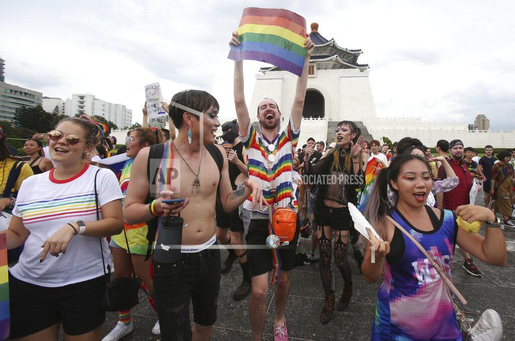 Chiang Ying-Ying Participants march during the "Taiwan Pride March for the World!" at Liberty Square at the CKS Memorial Hall in Taipei, Taiwan, Sunday, June 28, 2020. This year marks the first Gay Pride march in Chicago 1970, and due to the COVID-19 lockdown, Taiwan is one of the very few countries to host the world's only physical Gay Pride. (AP Photo/Chiang Ying-ying)