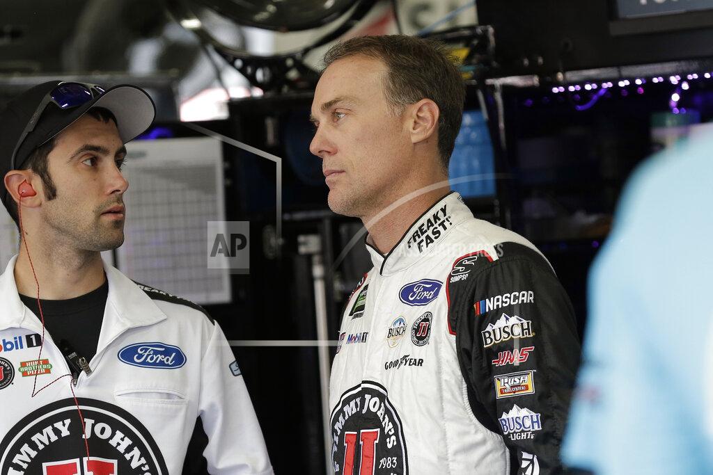 Gerry Broome Kevin Harvick, right, waits in the garage to practice for Sunday's NASCAR Cup Series auto race at Charlotte Motor Speedway in Concord, N.C., Saturday, Sept. 28, 2019. (AP Photo/Gerry Broome)