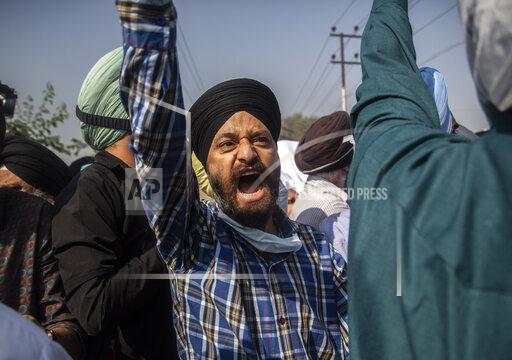 FILE - In this Oct. 8, 2021, file photo, Sikh community members shout slogans during the funeral of Supinder Kaur, a slain school principal in Srinagar, India. A spate of recent killings has rattled Indian-controlled Kashmir, with violence targeting local minority members and Indian civilians from outside the disputed region. (AP Photo/Mukhtar Khan, File)