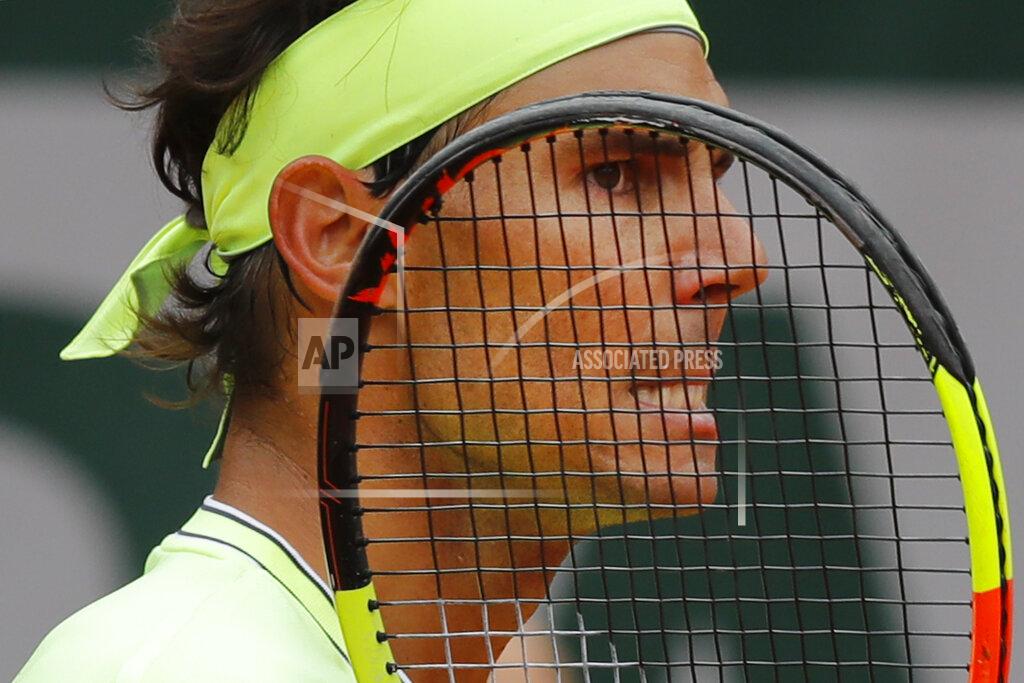 Michel Euler FILE - In this June 7, 2019, file photo, Spain's Rafael Nadal grimaces after scoring against Switzerland's Roger Federer during their semifinal match of the French Open tennis tournament at the Roland Garros stadium in Paris. The French Open has been postponed because of the coronavirus. The French Tennis Federation announced Tuesday, March 17, 2020, that the clay-court event will run from Sept. 20 to Oct. 4. Main draw competition was supposed to start on May 24. (AP Photo/Michel Euler, File)