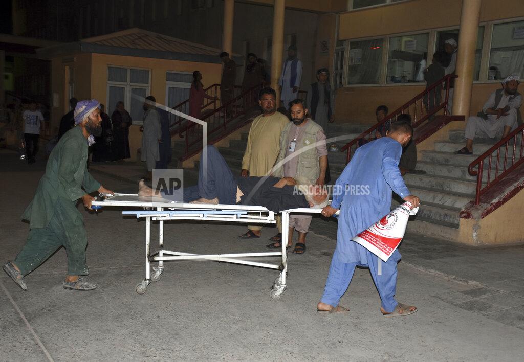 Masih Paeiz An injured man is transported to a hospital after a bombing in Mazar-e-Sharif, northern Afghanistan, Wednesday, May 25, 2022. A series of explosions shook Afghanistan on Wednesday, the Taliban said, including a blast inside a mosque in the capital of Kabul that killed at least five worshippers and three bombings of minivans in the country's north that killed nine passengers. (AP Photo/Masih Paeiz)