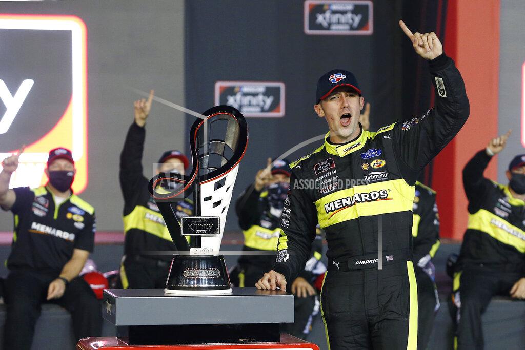 Ralph Freso FILE - In this Nov. 7, 2020, file photo, Austin Cindric celebrates in Victory Lane with the series championship trophy after winning the NASCAR Xfinity Series auto race at Phoenix Raceway in Avondale, Ariz. Cindric solidified his standing at Penske by winning six races last year and his first Xfinity Series championship. (AP Photo/Ralph Freso, File)