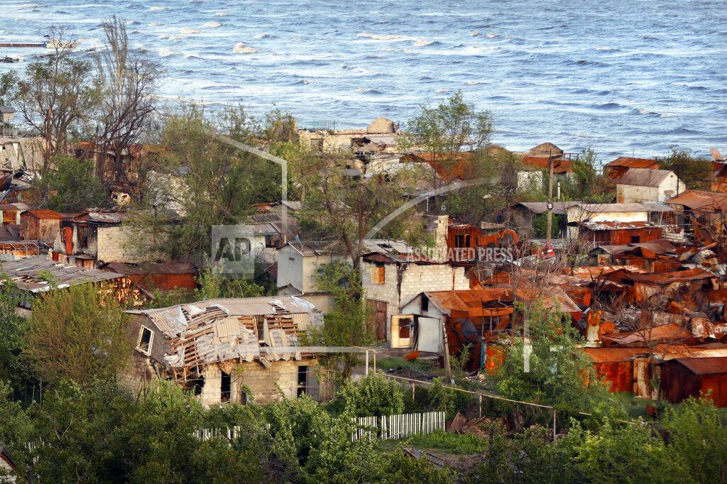 Alexei Alexandrov Heavily-damaged private houses are seen on the shore of the Sea of Azov in Mariupol, in territory under the government of the Donetsk People's Republic, eastern Ukraine, Saturday, May 21, 2022. (AP Photo/Alexei Alexandrov)