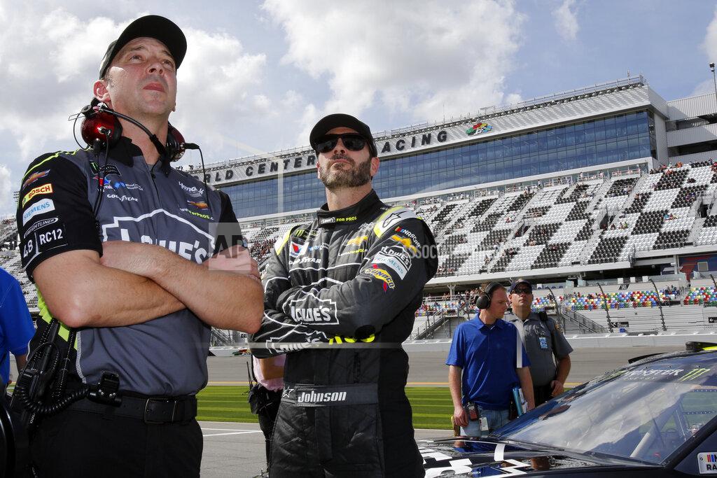 Terry Renna FILE - In this Feb. 11, 2018, file photo, crew chief Chad Knaus, left, and Jimmie Johnson watch the leaderboard during qualifying for the NASCAR Daytona 500 auto race at Daytona International Speedway in Daytona Beach, Fla. Johnson is retiring from full-time NASCAR competition in Sunday's season finale at Phoenix Raceway, leaving the sport as a seven-time champion ranked sixth on the all-time wins list with 83 career victories. (AP Photo/Terry Renna, File)