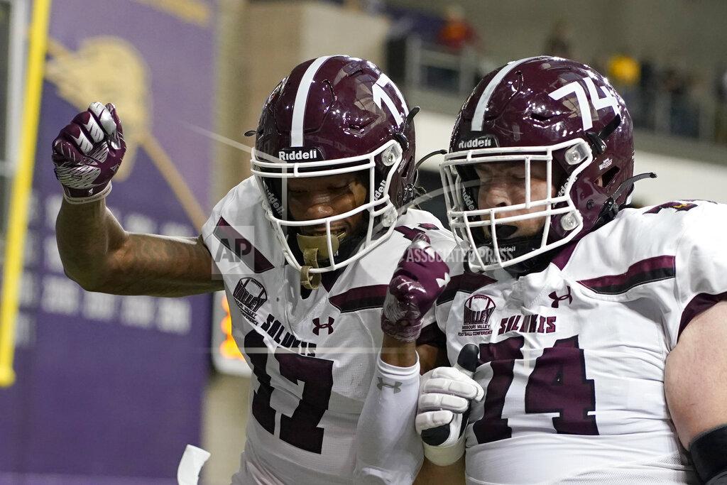 Charlie Neibergall Southern Illinois wide receiver Landon Lenoir (17) celebrates with teammate Lucas Davis (74) after catching a 52-yard touchdown pass in the first half of an NCAA college football game against Northern Iowa, Saturday, Oct. 30, 2021, in Cedar Falls, Iowa. (AP Photo/Charlie Neibergall)