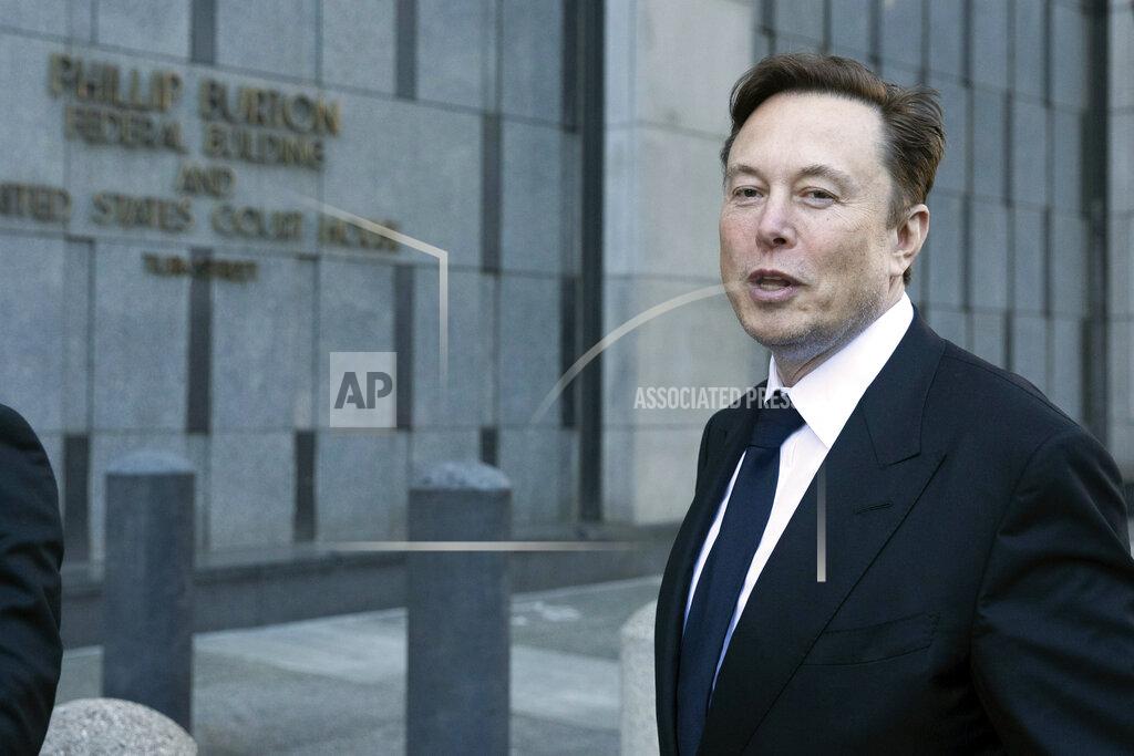 Benjamin Fanjoy Elon Musk leaves the Phillip Burton Federal Building and United States Court House in San Francisco, Tuesday, Jan. 24, 2023. Musk returned to federal court to defend himself against a class-action lawsuit that alleges he misled Tesla shareholders with a tweet about an aborted buyout that the billionaire defiantly insisted Tuesday he could have pulled off, had he wanted. (AP Photo/ Benjamin Fanjoy)
