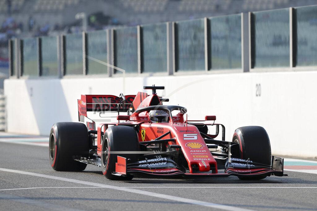 Kamran Jebreili Ferrari driver Sebastian Vettel of Germany steers his car during the third free practice at the Yas Marina racetrack in Abu Dhabi, United Arab Emirates, Saturday, Nov. 30, 2019. The Emirates Formula One Grand Prix will take place on Sunday. (AP Photo/Kamran Jebreili)