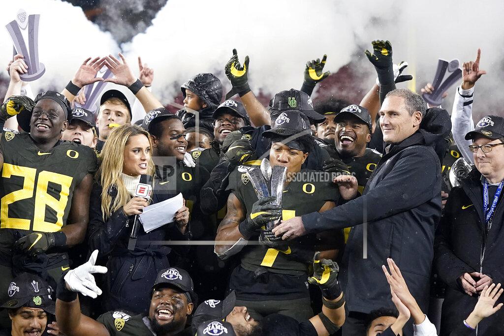 Tony Avelar Oregon running back CJ Verdell (7) and teammates celebrate after Oregon defeated Utah 37-15 in an NCAA college football game for the Pac-12 Conference championship in Santa Clara, Calif., Friday, Dec. 6, 2018. (AP Photo/Tony Avelar)