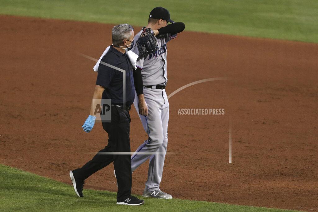 Jeffrey T. Barnes Miami Marlins pitcher Mike Morin is helped off the field during the sixth inning of a baseball game against the Toronto Blue Jays, Wednesday, Aug. 12, 2020, in Buffalo, N.Y. (AP Photo/Jeffrey T. Barnes)