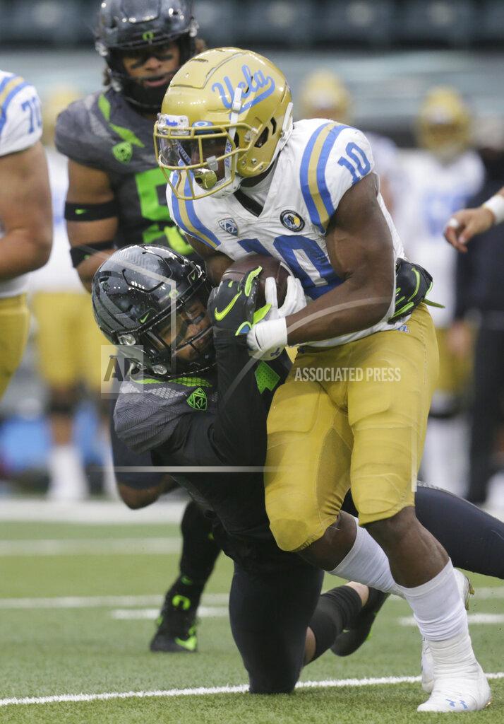 Chris Pietsch Oregon's Nick Pickett tackles UCLA's Demetric Felton during the third quarter of an NCAA college football game Saturday, Nov. 21, 2020, in Eugene, Ore. (AP Photo/Chris Pietsch)