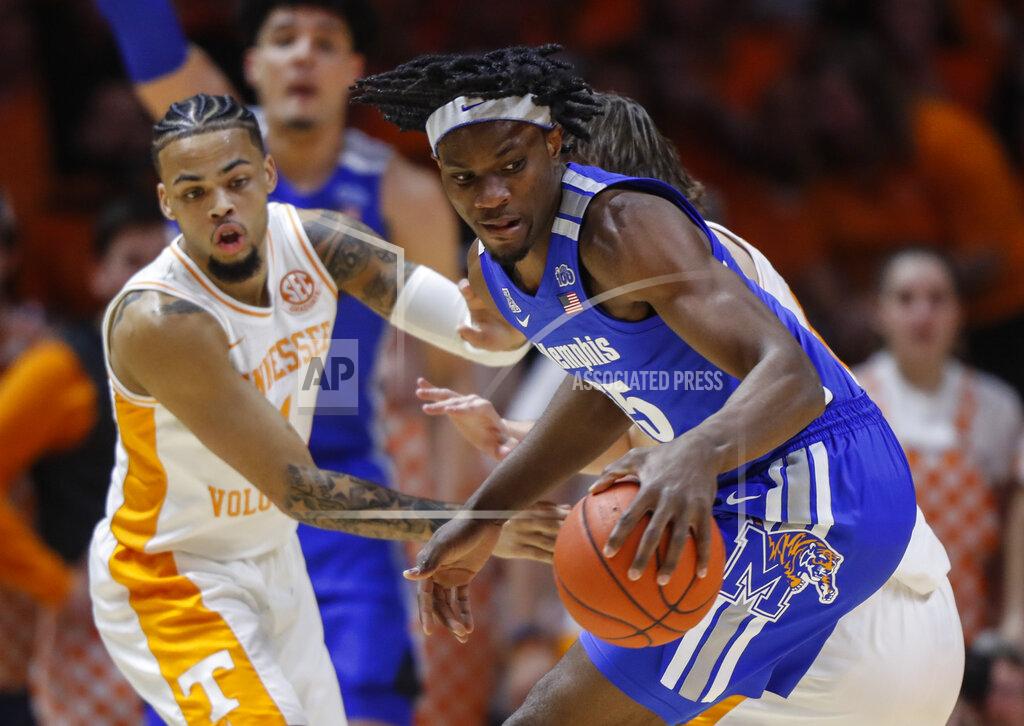 Wade Payne Memphis forward Precious Achiuwa (55) works for a shot as he's defended by Tennessee guard Lamonte Turner (1) during the first half of an NCAA college basketball game Saturday, Dec. 14, 2019, in Knoxville, Tenn. (AP Photo/Wade Payne)