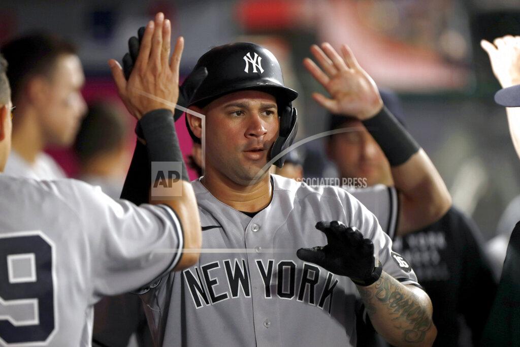 Alex Gallardo New York Yankees' Gary Sanchez is congratulated in the dugout after hitting a solo home run during the fifth inning of the team's baseball game against the Los Angeles Angels in Anaheim, Calif., Tuesday, Aug. 31, 2021. (AP Photo/Alex Gallardo)