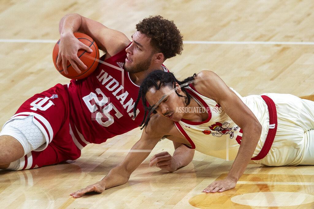 Kenneth Ferriera Indiana's Race Thompson, left, recovers a loose ball after diving against Nebraska's Derrick Walker during an NCAA college basketball game on Sunday, Jan. 10, 2021. (Kenneth Ferriera/Lincoln Journal Star via AP)