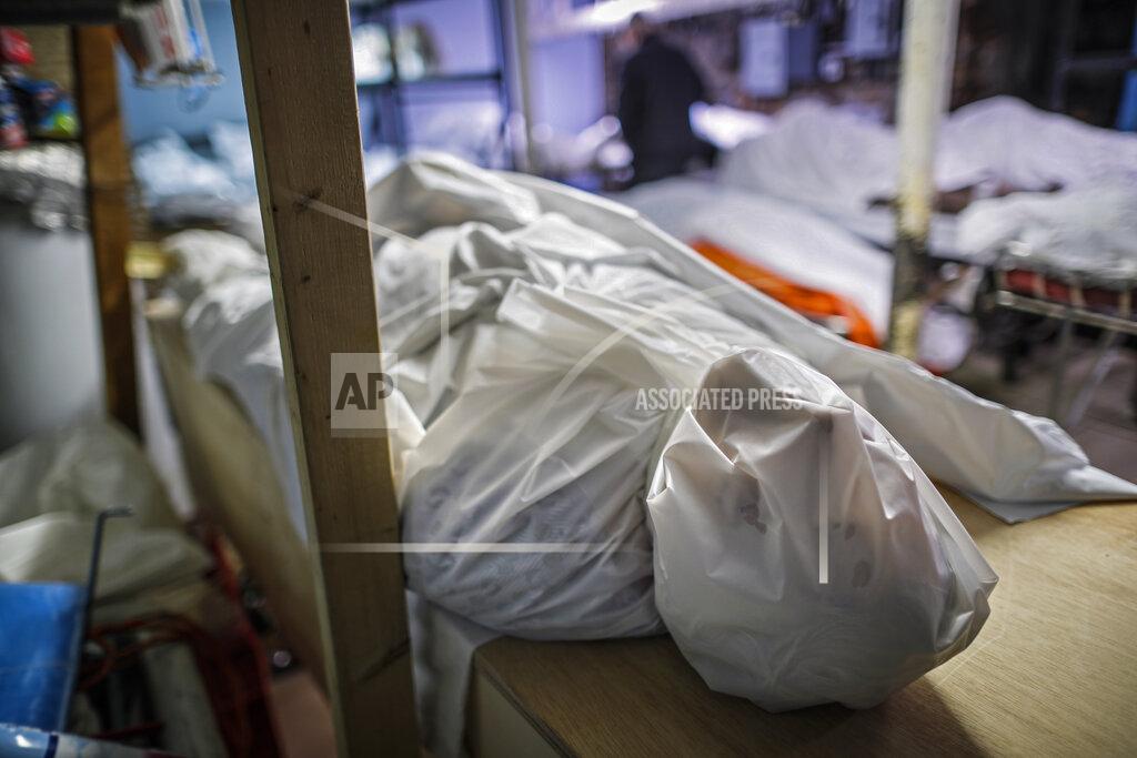 John Minchillo Bodies are wrapped in protective plastic in a holding facility during the coronavirus pandemic at Daniel J. Schaefer Funeral Home, April 2, 2020, in the Brooklyn borough of New York. (AP Photo/John Minchillo)