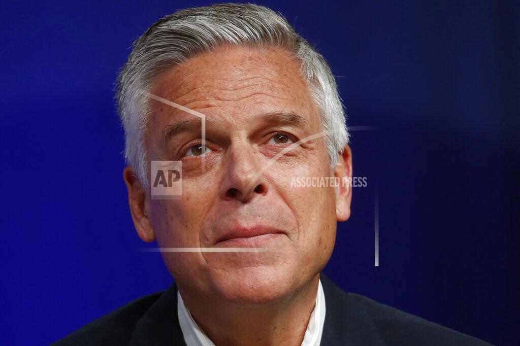 In this May 20, 2020 photo, Republican Utah gubernatorial candidate and former ambassador Jon Huntsman Jr. looks on during a debate in Salt Lake City. Huntsman says he has tested positive for COVID-19. Huntsman said Wednesday, June 10, 2020, he is experiencing "classic symptoms" of the illness caused by the coronavirus, and will isolate himself while his campaign continues.(AP Photo/Rick Bowmer)