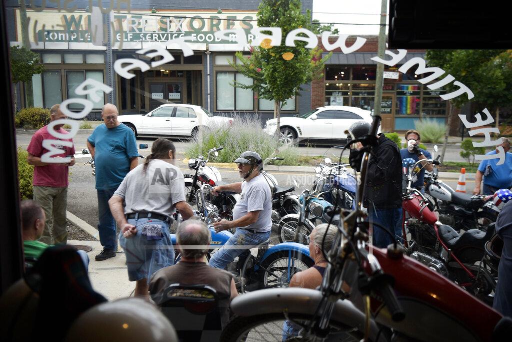 Calvin Mattheis Time Warp Vintage Motorcycle Club members gather on June 28, 2022, at Time Warp Tea Room on North Central Street which closed its doors this week after 20 years of business in Knoxville., Tenn. "These are time machines; they take you back to a different period in your life," Pat Deason said. "You get on these motorcycles, you remember the adventures you had on them, where you were, what you did, who your buddies were. … That's the real attraction." The group visits Twisters Shakes and Sundaes on North Central Street for its next meeting. (Calvin Mattheis/Knoxville News Sentinel via AP)