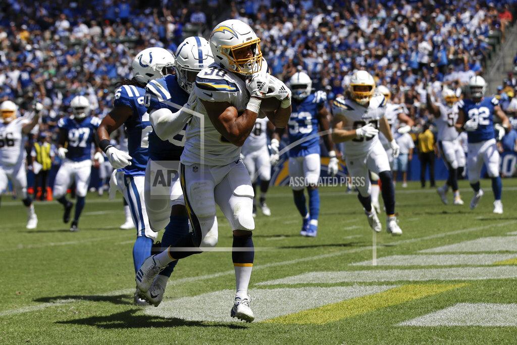 Marcio Jose Sanchez Los Angeles Chargers running back Austin Ekeler scores against the Indianapolis Colts during the first half in an NFL football game Sunday, Sept. 8, 2019, in Carson, Calif. (AP Photo/Marcio Jose Sanchez)