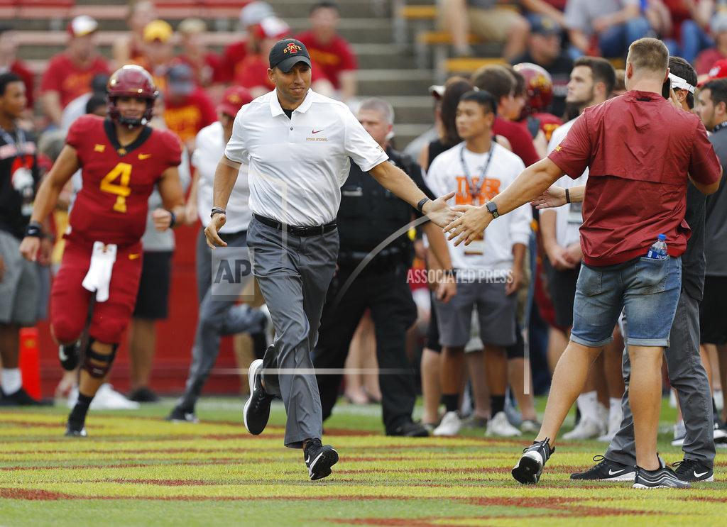 Matthew Putney Iowa State head coach Matt Campbell, center, runs on the field and high fives fans before an NCAA college football game against South Dakota State , Saturday, Sept. 1, 2018, in Ames, Iowa. (AP Photo/Matthew Putney)