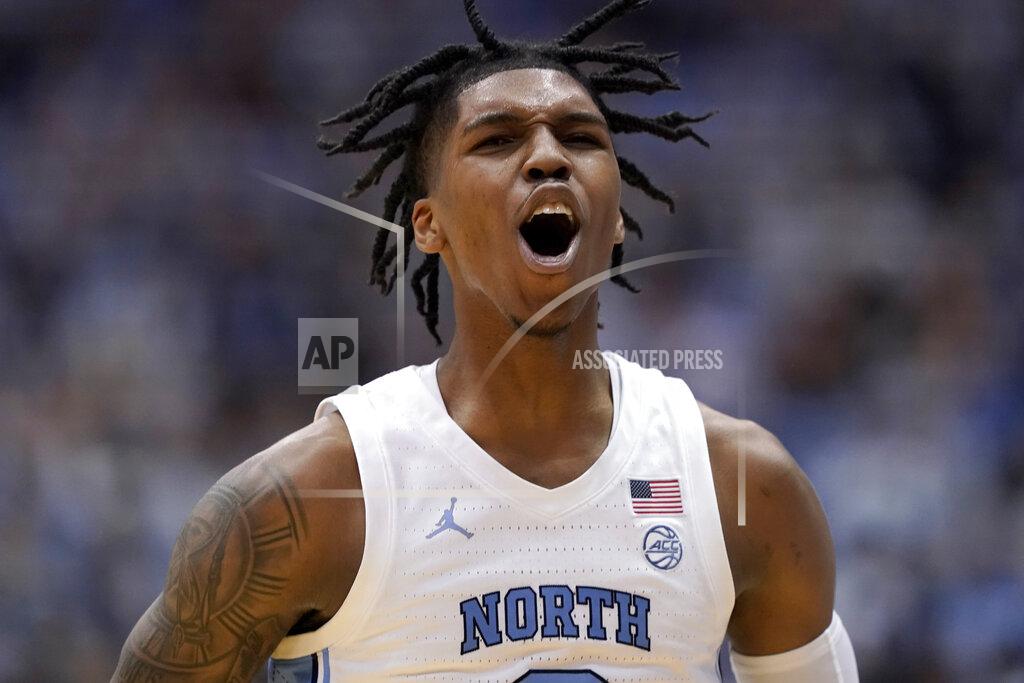 Gerry Broome North Carolina guard Caleb Love (2) celebrates following a play against North Carolina State during the second half of an NCAA college basketball game in Chapel Hill, N.C., Saturday, Jan. 29, 2022. (AP Photo/Gerry Broome)
