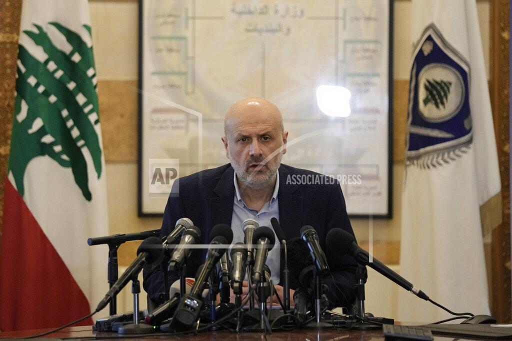 Hassan Ammar Lebanese Interior Minister Bassam Mawlawi, center, speaks during a press conference about Sunday's parliamentary elections, at the interior ministry in Beirut, Lebanon, Monday, May 16, 2022. Lebanon's militant Hezbollah group and its allies suffered losses in this weekend's parliamentary elections, with preliminary results Monday showing some of their most vocal opponents picking up more seats and several of their traditional partners routed out of the legislature. (AP Photo/Hassan Ammar)