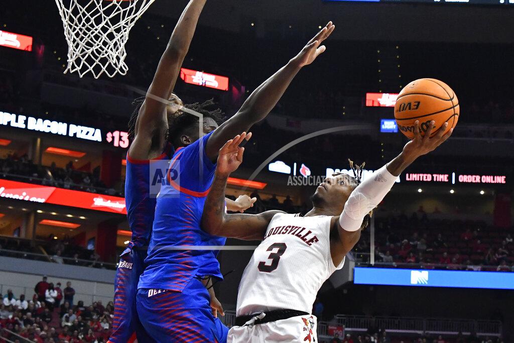 Timothy D. Easley Louisville guard El Ellis (3) shoots over DePaul forward David Jones, middle, and center Nick Ongenda during the second half of an NCAA college basketball game in Louisville, Ky., Friday, Dec. 10, 2021. (AP Photo/Timothy D. Easley)