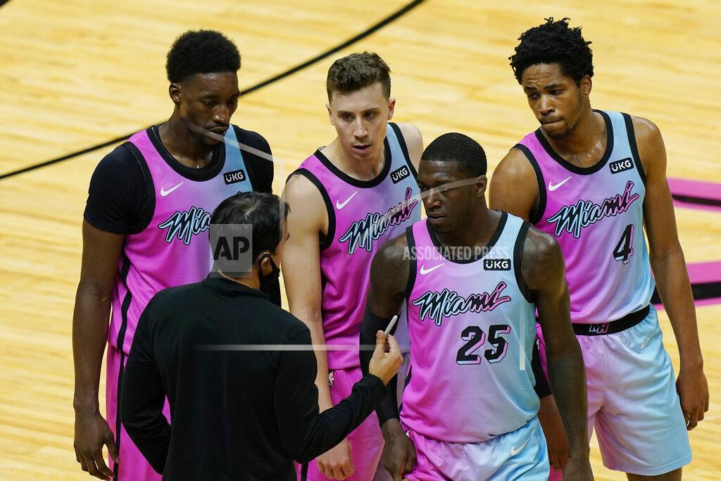 Marta Lavandier Miami Heat head coach Erik Spoelstra talks to center Bam Adebayo, left, guard Duncan Robinson, guard Kendrick Nunn (25) and forward KZ Okpala (4) during the last minutes of the second half of an NBA basketball game against the Los Angeles Clippers, Thursday, Jan. 28, 2021, in Miami. The Los Angeles Clippers defeated the Heat 109-105. (AP Photo/Marta Lavandier)