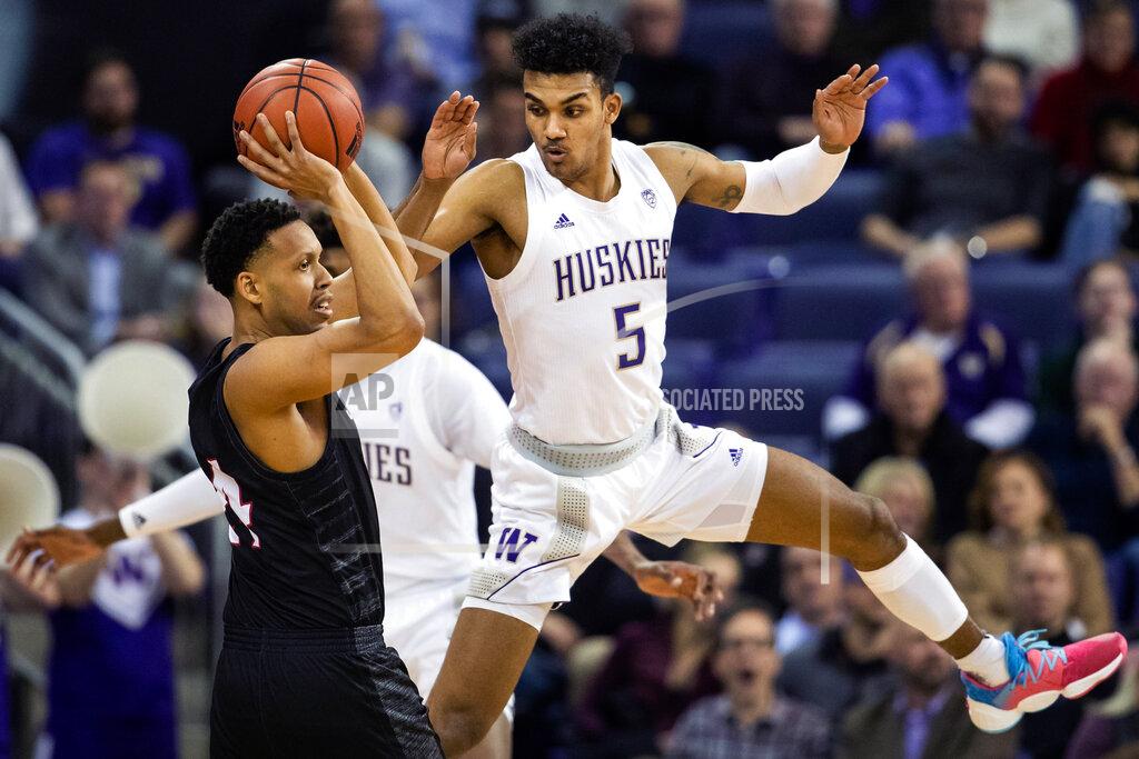 Andy Bao Washington guard Jamal Bey (5) guards Seattle guard Delante Jones (24) during the first half of an NCAA college basketball game, Tuesday, Dec. 17, 2019, in Seattle. (Andy Bao/The Seattle Times via AP)
