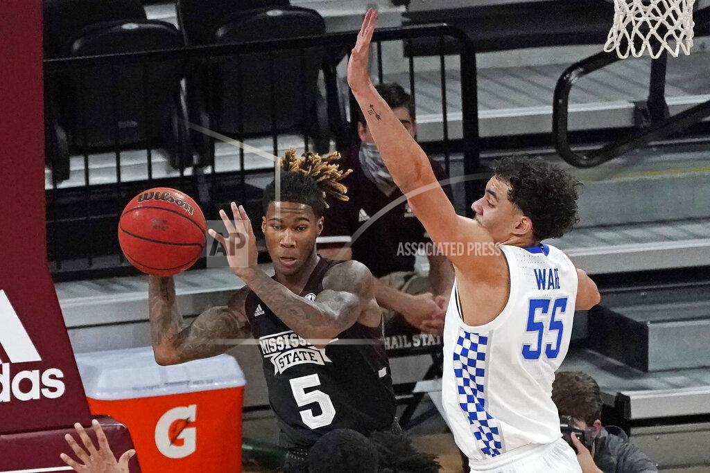 Rogelio V. Solis Mississippi State guard Deivon Smith (5) passes out a rebound as Kentucky forward Lance Ware (55) defends during the second half of an NCAA college basketball game in Starkville, Miss., Saturday, Jan. 2, 2021. Kentucky won 78-73. (AP Photo/Rogelio V. Solis)