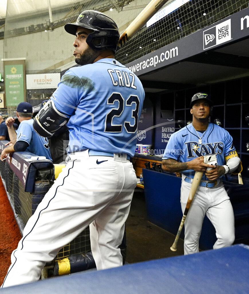 Steve Nesius Tampa Bay Rays' Nelson Cruz (23) and Wander Franco get ready to bat against the Miami Marlins during the first inning of a baseball game Sunday, Sept. 26, 2021, in St. Petersburg, Fla. (AP Photo/Steve Nesius)