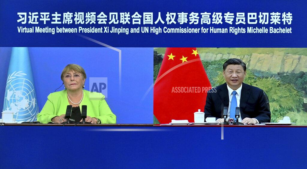 Yue Yuewei In this photo released by Xinhua News Agency, A screen showing Chinese President Xi Jinping, right, holds a virtual meeting with United Nations High Commissioner for Human Rights Michelle Bachelet, Wednesday, May 25, 2022. Xi defended China's record to the top U.N. human rights official Wednesday, saying each nation should be allowed to find its own path based on its particular circumstances and criticizing those countries that lecture others on human rights and politicize the issue. (Yue Yuewei/Xinhua via AP)