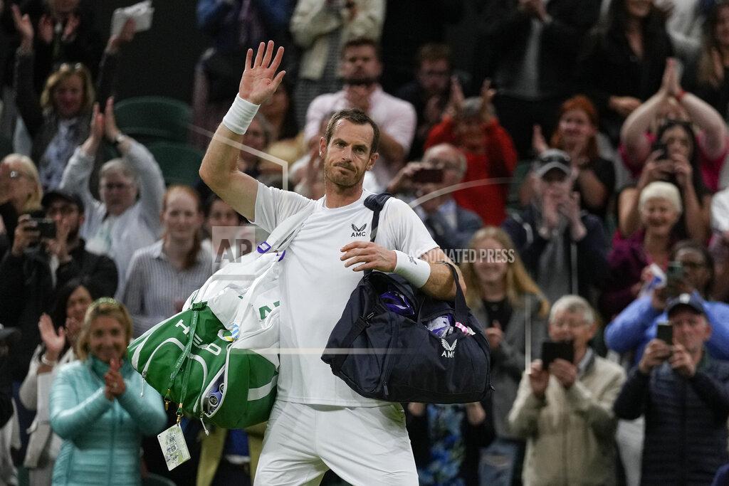 Alastair Grant Britain's Andy Murray waves after losing a singles tennis match against John Isner of the US on day three of the Wimbledon tennis championships in London, Wednesday, June 29, 2022. (AP Photo/Alastair Grant)