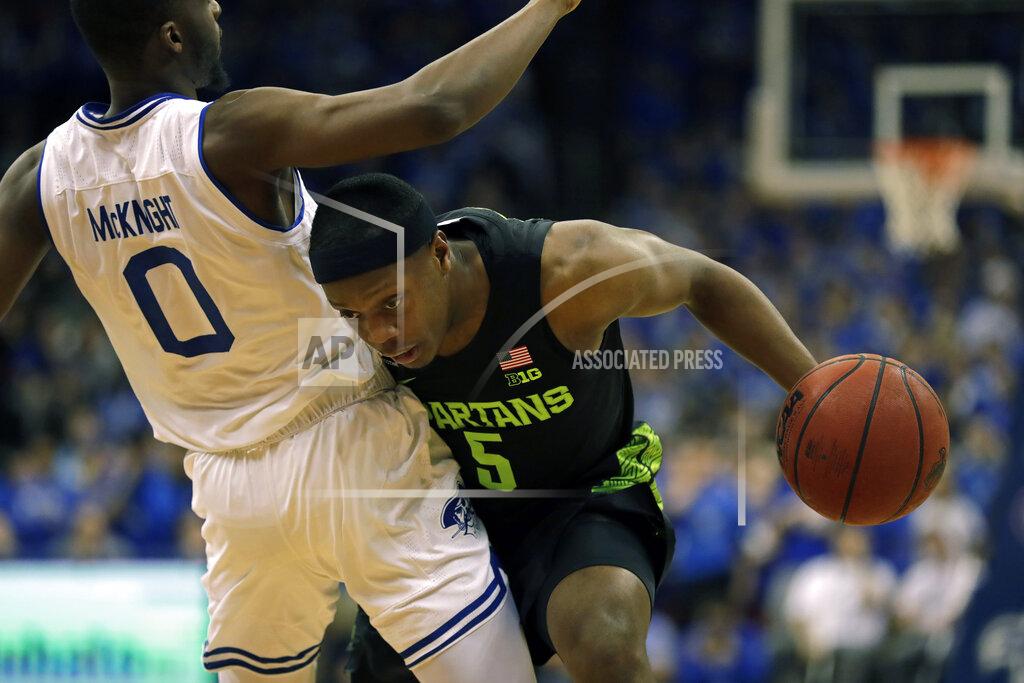 Adam Hunger Michigan State guard Cassius Winston (5) is called for a foul against Seton Hall guard Quincy McKnight during the first half of an NCAA college basketball game Thursday, Nov. 14, 2019, in Newark, N.J. (AP Photo/Adam Hunger)