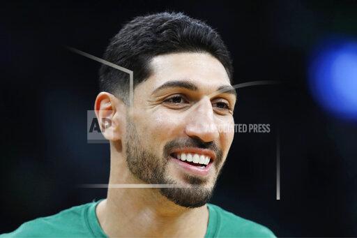 FILE - Boston Celtics' Enes Kanter smiles before an NBA basketball game against the Toronto Raptors, on Oct. 22, 2021, in Boston. The Celtics center changed his name from Enes Kanter, to Enes Kanter Freedom, in celebration of him officially becoming a United States citizen on Monday, Nov. 29, 2021. (AP Photo/Michael Dwyer, File)