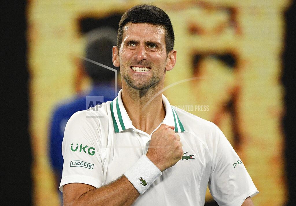 Andy Brownbill Serbia's Novak Djokovic celebrates after defeating Russia's Aslan Karatsev in their semifinal match at the Australian Open tennis championship in Melbourne, Australia, Thursday, Feb. 18, 2021.(AP Photo/Andy Brownbill)