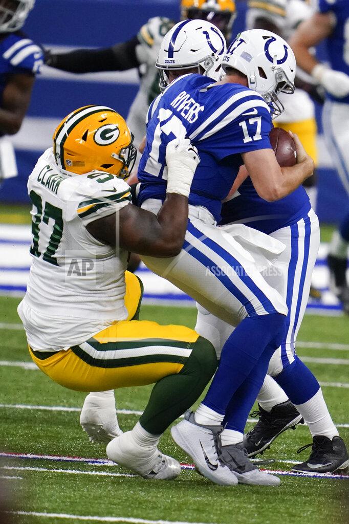 Michael Conroy Indianapolis Colts quarterback Philip Rivers (17) is sacked by Green Bay Packers' Kenny Clark (97) during the second half of an NFL football game, Sunday, Nov. 22, 2020, in Indianapolis. (AP Photo/Michael Conroy)