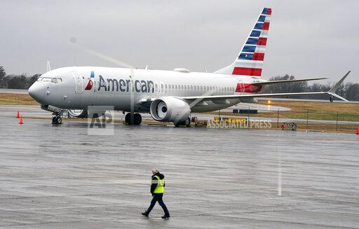 FILE - An American Airlines Boeing 737 Max jet plane is parked at a maintenance facility in Tulsa, Okla., Wednesday, Dec. 2, 2020. A former Boeing test pilot pleaded not guilty Friday, Oct. 15, 2021, to charges that he deceived regulators by withholding information about a key system that played a role in two deadly crashes involving Boeing 737 Max jets. (AP Photo/LM Otero, File)