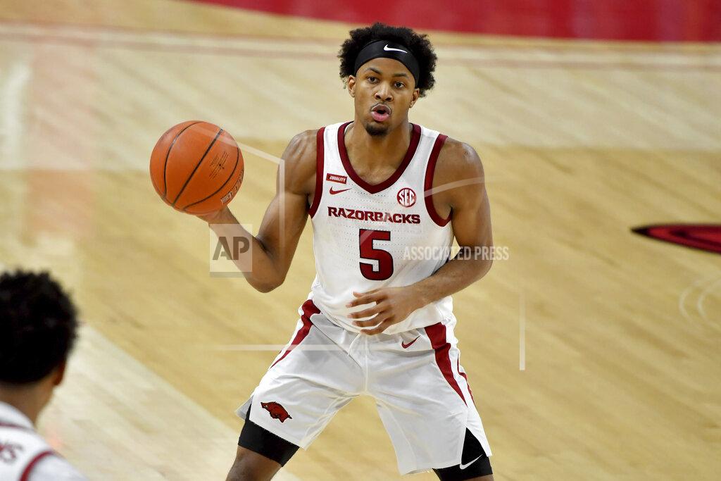 Michael Woods Arkansas guard Moses Moody (5) passes the ball against Georgia during the second half of an NCAA college basketball game Saturday, Jan. 9, 2021, in Fayetteville, Ark. (AP Photo/Michael Woods)