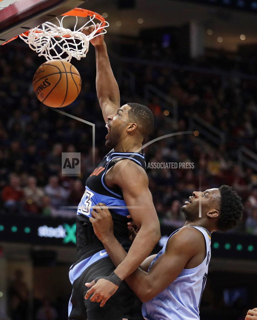 Tony Dejak Cleveland Cavaliers' Tristan Thompson, left, dunks against Memphis Grizzlies' Jaren Jackson Jr. in the second half of an NBA basketball game, Friday, Dec. 20, 2019, in Cleveland. (AP Photo/Tony Dejak)