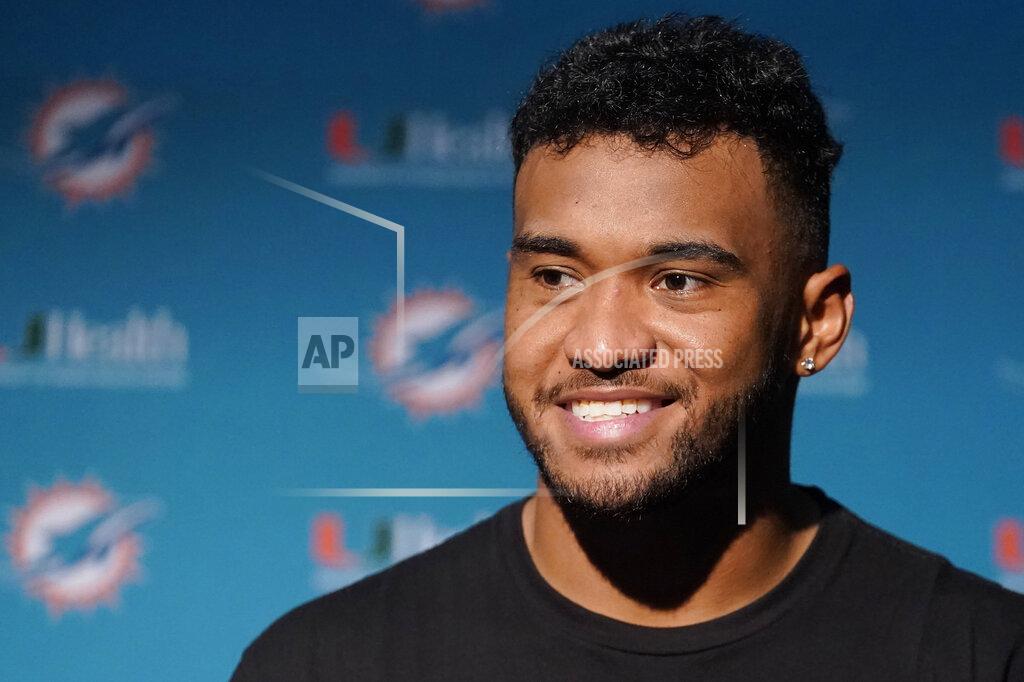 Steven Senne Miami Dolphins quarterback Tua Tagovailoa smiles during a news conference after a win over the New England Patriots in an NFL football game, Sunday, Sept. 12, 2021, in Foxborough, Mass. (AP Photo/Steven Senne)