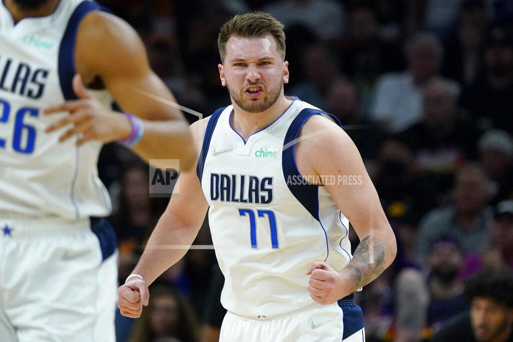 Matt York Dallas Mavericks guard Luka Doncic (77) celebrates a basket against the Phoenix Suns during the first half of Game 7 of an NBA basketball Western Conference playoff semifinal, Sunday, May 15, 2022, in Phoenix. (AP Photo/Matt York)