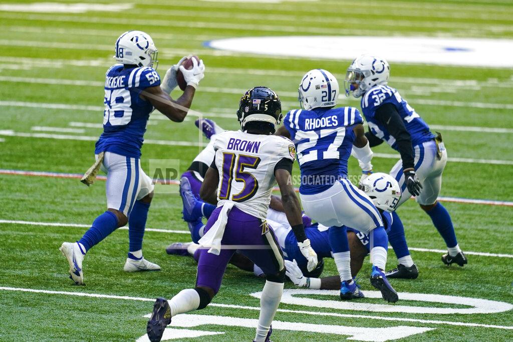 Darron Cummings Indianapolis Colts inside linebacker Bobby Okereke (58) picks up a fumble by the Baltimore Ravens in the second half of an NFL football game in Indianapolis, Sunday, Nov. 8, 2020. (AP Photo/Darron Cummings)