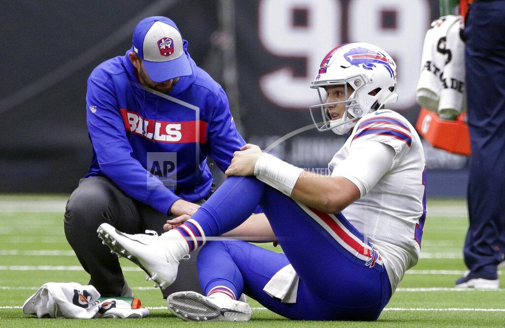 Michael Wyke FILE - In this Oct. 14, 2018, file photo, Buffalo Bills quarterback Josh Allen (17) is check on after he was injured during the second half of an NFL football game against the Houston Texans in Houston. In making his NFL playoff debut against the Texans this weekend, second-year Buffalo Bills quarterback Josh Allen gets an opportunity to show how far he's come since his last trip to Houston 14 months ago. (AP Photo/Michael Wyke, File)