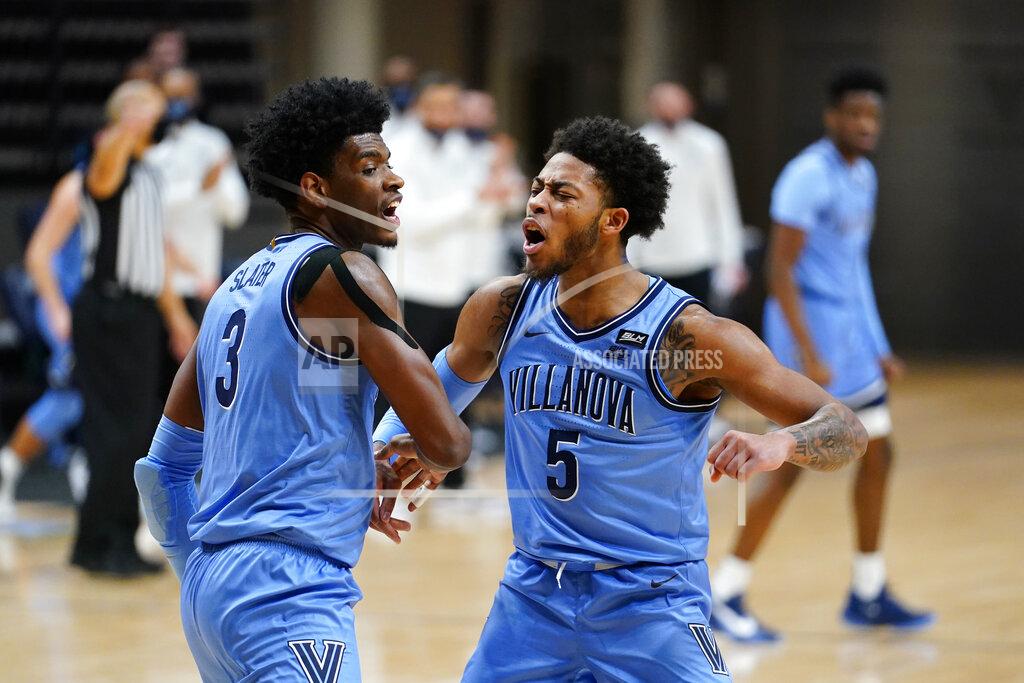 Matt Slocum Villanova's Brandon Slater, left, and Justin Moore react after a basket during the first half of an NCAA college basketball game against St. John's, Tuesday, Feb. 23, 2021, in Villanova, Pa. (AP Photo/Matt Slocum)