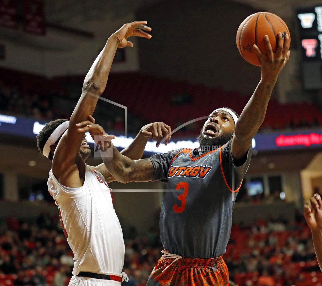 Brad Tollefson Texas-Rio Grande Valley's Terry Winn III (3) shoots around Texas Tech's Tariq Owens (11) during the first half of an NCAA college basketball game Friday, Dec. 28, 2018, in Lubbock, Texas. (AP Photo/Brad Tollefson)