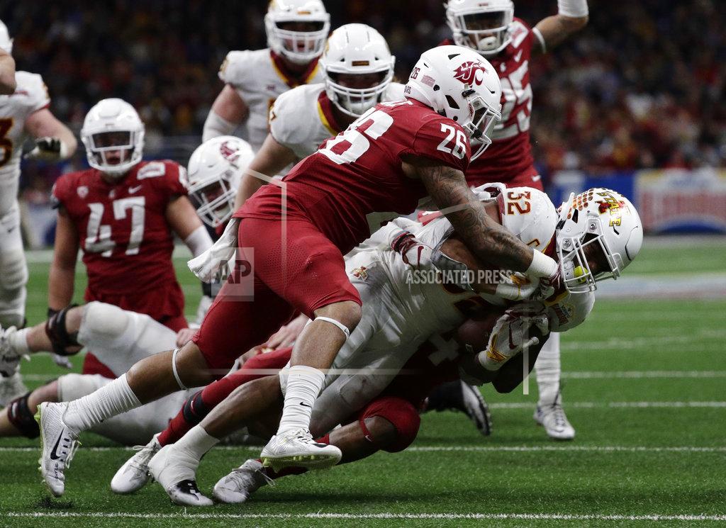 Eric Gay Iowa State running back David Montgomery (32) is hit by Washington State defensive back Hunter Dale (26) and another defender, partially obscure, during the second half of the Alamo Bowl NCAA college football game Friday, Dec. 28, 2018, in San Antonio. (AP Photo/Eric Gay)