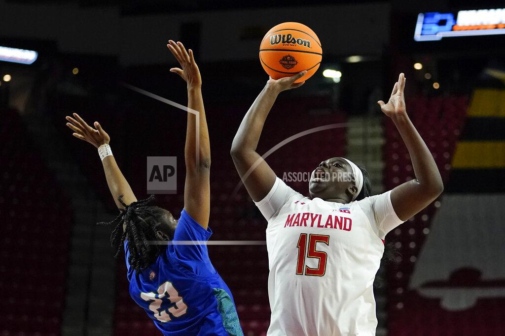 Julio Cortez Maryland guard Ashley Owusu (15) goes up for a shot against Florida Gulf Coast guard Karli Seay (23) during the second half of a college basketball game in the second round of the NCAA tournament, Sunday, March 20, 2022, in College Park, Md. Maryland won 89-65. (AP Photo/Julio Cortez)