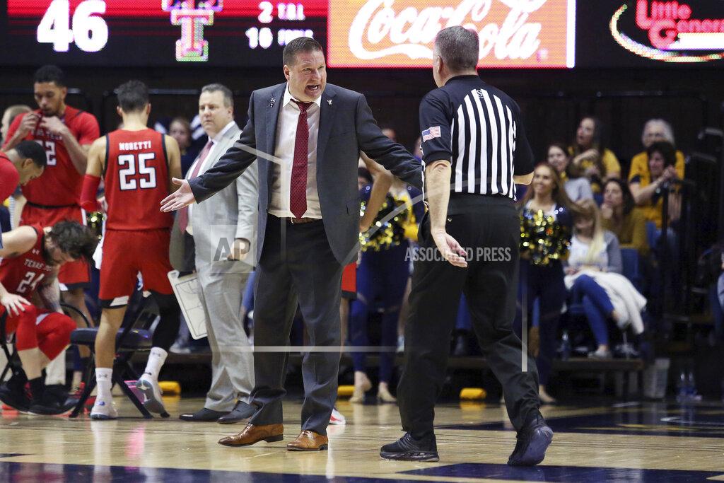 Kathleen Batten Texas Tech coach Chris Beard, center left, speaks with an official during the second half of an NCAA college basketball game against West Virginia, Saturday, Jan. 11, 2020, in Morgantown, W.Va. (AP Photo/Kathleen Batten)