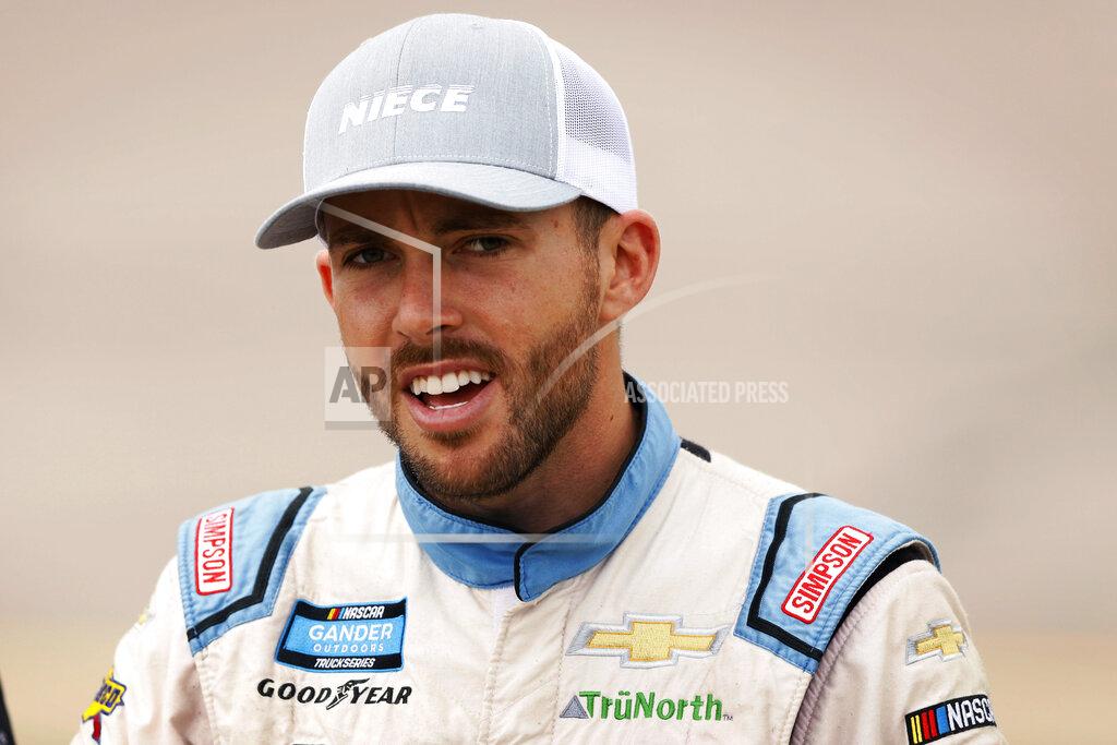 Charlie Neibergall Ross Chastain walks to his truck before the start of the NASCAR Truck Series auto race, Sunday, June 16, 2019, at Iowa Speedway in Newton, Iowa. (AP Photo/Charlie Neibergall)